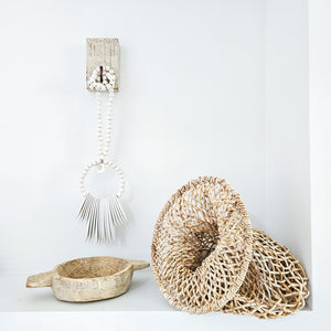 Wood bead wall hanging, cuttlefish shape, white paint finish. Coastal Bohemian, boho home decor styling