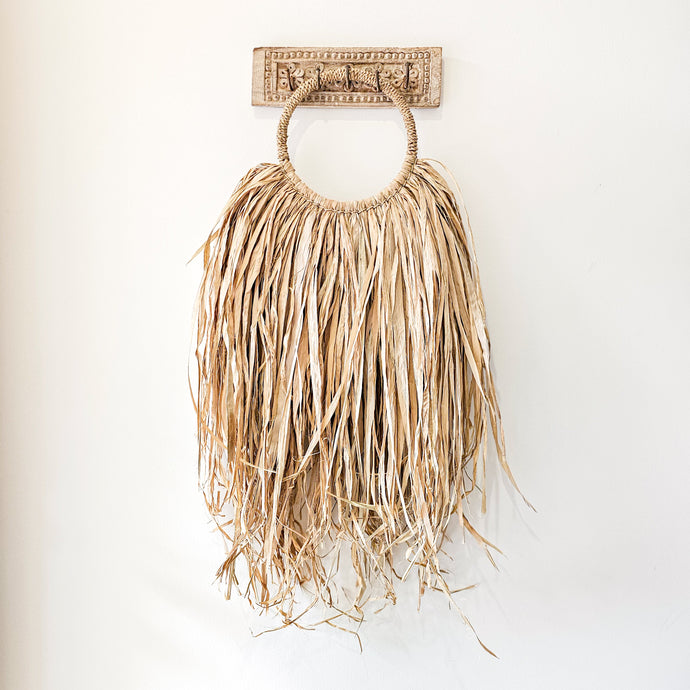 Coastal bohemian, boho, natural raffia wall hanging. natural wall art style. Unique, handcrafted Bali style home decor with rustic earthy textures. Unique wall decor.