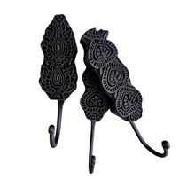 Matte black wall hooks with a carved design. Ideal for styling in your home entry, loungeroom, laundry, and more. Home decor for boho bohemian coastal interiors. Wall decor, natural wall decor for natural wall art hangings.