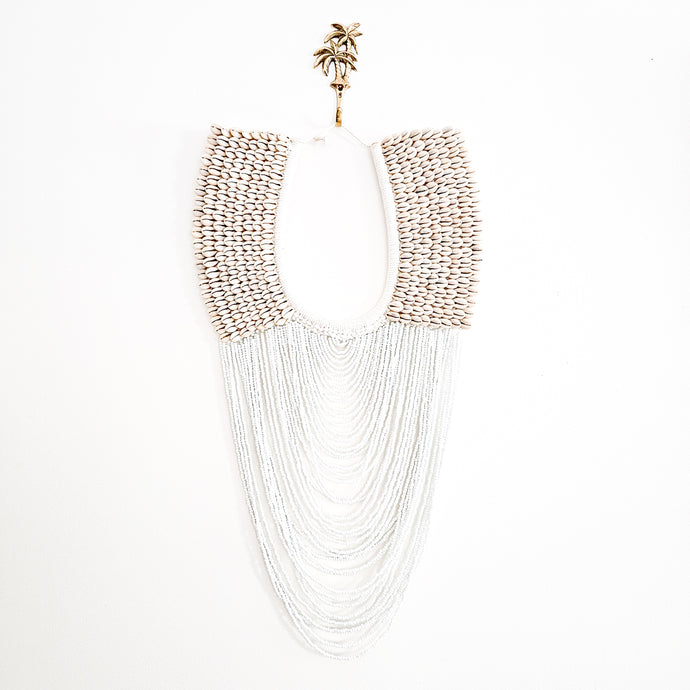 Cowrie shell and white beaded strands wall hanging decor for coastal boho, bohemian home decor. Handmade wall art decor