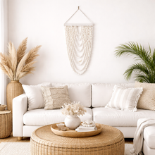 Coastal shell wall hanging featuring 9 cascading strands, designed to bring natural texture and relaxed boho style into your home. Measuring 105cm long x 40cm wide, this lightweight statement piece is perfect for styling in living rooms, bedrooms or entryways.
