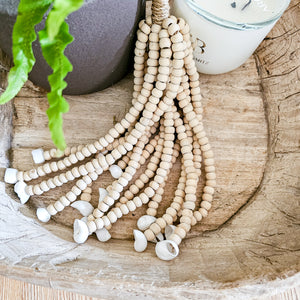 Mini wooden bead wall tassel. Decor tassel. Natural hamdcrafted wall art decor for coastal boho, farmhouse home decor. Home interior decor for coastal boho styles.