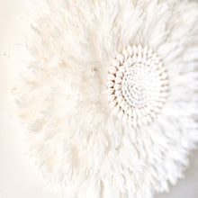 Soft white Feather and shell wall juju art. Natural wall hanging for a Coastal boho, Bohemian Home aesthetic. Wall decor art with soft textures and shell design in the center. Large unique wall decor.
White Feather Juju. 