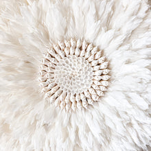 Soft white Feather and shell wall juju art. Natural wall hanging for a Coastal boho, Bohemian Home aesthetic. Wall decor art with soft textures and shell design in the center. Large unique wall decor.
White Feather Juju. 
