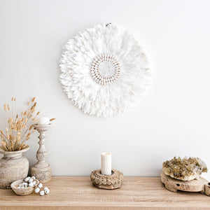 Soft white Feather and shell wall juju art. Natural wall hanging for a Coastal boho, Bohemian Home aesthetic. Wall decor art with soft textures and shell design in the center. Large unique wall decor.
White Feather Juju. 