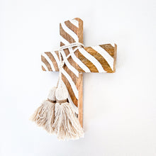 Mango wood hand carved cross with intricate wave design. Handcrafted wall decor, wall cross with cotton tassels 