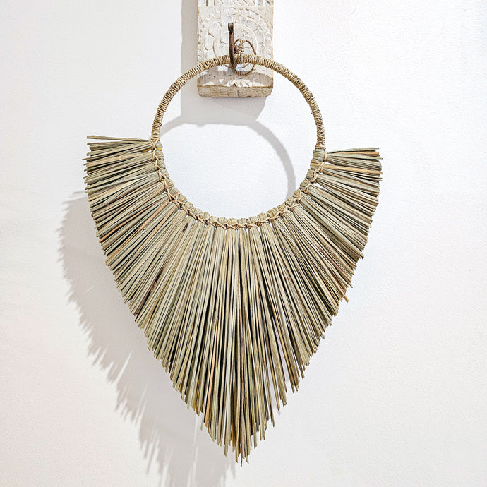 Sarai seagrass triangular shaped natural wall hanging. Coastal Bohemian, boho style home decor. Unique wall art decor.