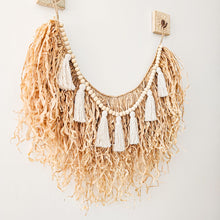 Natural straw, Raffia hanging with wood beaded garland of cotton tassels. Coastal Bohemain, boho inspired home. Coastal boho interior style wall hangings. Natural wall art. Natural earrhy organic materials. 